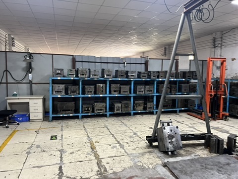 Tooling stored on factory racks during a Taotao business visit