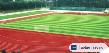 Red all-weather running track around a soccer field