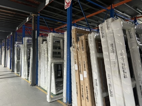 Packaged window components stored during a Taotao factory visit